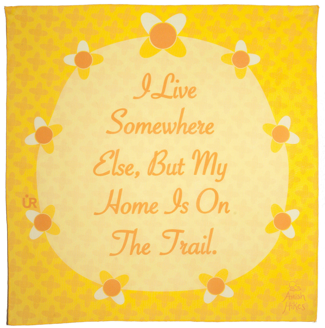Anish Bandana UR Sportswear collaboration. Yellow bandana that has flowers around a circle. The bandana is inspirational and says, I live somewhere else, but my home is on the trail. A quote by Anish.